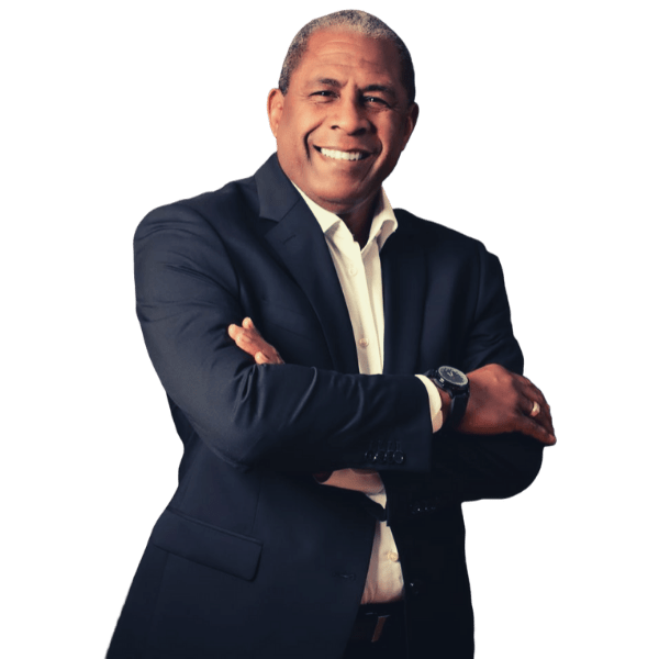 Ken Corbie, executive coach, smiling with arms crossed